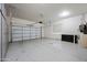 Spacious garage with white garage door and light gray flooring at 6202 E Mckellips Rd # 310, Mesa, AZ 85215