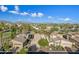 Aerial view of community with houses near golf course and mountains at 6202 E Mckellips Rd # 310, Mesa, AZ 85215