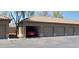 Row of garages with one showing a red car at 7027 N Scottsdale Rd # 237, Scottsdale, AZ 85253
