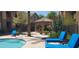 Inviting pool and spa area with comfortable lounge chairs and a shaded gazebo at 7027 N Scottsdale Rd # 237, Scottsdale, AZ 85253