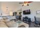 Gathering room with sectional sofa and view into kitchen at 13355 N 100Th Pl, Scottsdale, AZ 85260