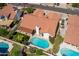 Aerial view showcasing a house, pool, and surrounding landscape at 13355 N 100Th Pl, Scottsdale, AZ 85260