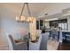 Open dining area with glass-top table and kitchen views at 13355 N 100Th Pl, Scottsdale, AZ 85260