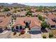 Single story home with red tile roof and landscaped yard at 13355 N 100Th Pl, Scottsdale, AZ 85260