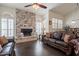 Spacious living room featuring a fireplace and dark hardwood floors at 13355 N 100Th Pl, Scottsdale, AZ 85260