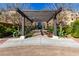 Elegant community entrance with pergola at 6166 N Scottsdale Rd # C3006, Paradise Valley, AZ 85253