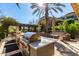 Outdoor kitchen with stainless steel grill and ample counter space at 6166 N Scottsdale Rd # C3006, Paradise Valley, AZ 85253
