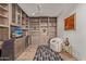 Home office with built-in bookshelves and comfortable seating at 6166 N Scottsdale Rd # C3006, Paradise Valley, AZ 85253