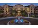 Attractive community exterior featuring a fountain and nighttime lighting at 6166 N Scottsdale Rd # C3006, Paradise Valley, AZ 85253