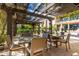Inviting patio with shaded seating area and multiple tables at 6166 N Scottsdale Rd # C3006, Paradise Valley, AZ 85253