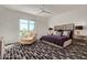 Spacious bedroom with plush carpet, large bed, and plenty of natural light at 6166 N Scottsdale Rd # C3006, Paradise Valley, AZ 85253