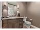 Chic powder room with marble vanity and textured walls at 6166 N Scottsdale Rd # C3006, Paradise Valley, AZ 85253
