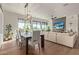 Modern dining area with large windows and hardwood floors at 6166 N Scottsdale Rd # C3006, Paradise Valley, AZ 85253