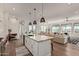 Open concept kitchen and living area with modern finishes and city views at 6166 N Scottsdale Rd # C3006, Paradise Valley, AZ 85253