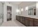 Luxurious bathroom with double vanity, granite countertops, and walk-in shower at 6166 N Scottsdale Rd # C3006, Paradise Valley, AZ 85253