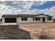 New single-story home with a brown garage door at 13628 S 192Nd Ave, Buckeye, AZ 85326