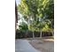 Backyard with mature trees and a concrete patio at 15151 N 100Th Way, Scottsdale, AZ 85260