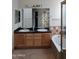 Bathroom with double sinks, granite countertops, and a large bathtub at 15151 N 100Th Way, Scottsdale, AZ 85260