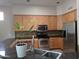 Modern kitchen with stainless steel appliances and wood cabinets at 15151 N 100Th Way, Scottsdale, AZ 85260