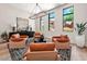 Relaxing sitting area featuring leather armchairs and a stylish rug at 24892 N 107Th St, Scottsdale, AZ 85255