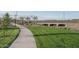 Concrete walkway next to a grassy area at 24066 N 162Nd Ln, Surprise, AZ 85387