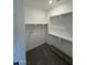 Large walk-in closet with ample shelving at 24066 N 162Nd Ln, Surprise, AZ 85387