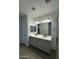 Modern bathroom with double vanity and gray cabinets at 24066 N 162Nd Ln, Surprise, AZ 85387