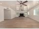 Spacious living room with light wood floors and modern fireplace at 6325 E Monte Cristo Ave, Scottsdale, AZ 85254