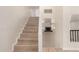Modern staircase with light wood flooring leading to the upper level at 6325 E Monte Cristo Ave, Scottsdale, AZ 85254