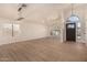 Open living area with high ceilings, lots of natural light, and wood-look floors at 6325 E Monte Cristo Ave, Scottsdale, AZ 85254