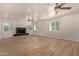Spacious living room with light wood floors and a modern fireplace at 6325 E Monte Cristo Ave, Scottsdale, AZ 85254