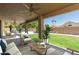Relaxing covered patio with seating area overlooking the pool at 6325 E Monte Cristo Ave, Scottsdale, AZ 85254