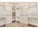 Spacious walk-in closet with ample shelving and drawers at 6325 E Monte Cristo Ave, Scottsdale, AZ 85254