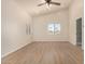 Bright bedroom with wood-look floors and large windows at 6325 E Monte Cristo Ave, Scottsdale, AZ 85254