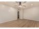 Light and airy bedroom with ceiling fan and wood-look flooring at 6325 E Monte Cristo Ave, Scottsdale, AZ 85254