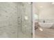 Modern bathroom with marble shower and freestanding tub at 6325 E Monte Cristo Ave, Scottsdale, AZ 85254