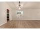 Bright dining room features light wood flooring and a modern light fixture at 6325 E Monte Cristo Ave, Scottsdale, AZ 85254