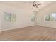 Spacious bedroom featuring wood-look floors and multiple windows at 6325 E Monte Cristo Ave, Scottsdale, AZ 85254