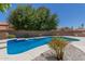 Inviting kidney-shaped pool with surrounding landscaping at 6325 E Monte Cristo Ave, Scottsdale, AZ 85254