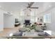 Open concept living and dining area with a modern fireplace and lots of light at 6325 E Monte Cristo Ave, Scottsdale, AZ 85254