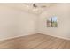Bright bedroom with wood-look floors and ceiling fan at 6325 E Monte Cristo Ave, Scottsdale, AZ 85254
