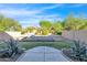 Spacious backyard with fire pit and grassy area at 8640 E Indigo St, Mesa, AZ 85207