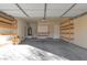 Garage interior with built-in shelving and workbench at 8640 E Indigo St, Mesa, AZ 85207