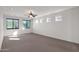 Bright bedroom with ceiling fan and large windows at 8640 E Indigo St, Mesa, AZ 85207