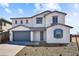 Two story home with gray siding and a two car garage at 5881 N 193Rd Dr, Litchfield Park, AZ 85340