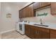 Laundry room with washer, dryer, and ample counter space at 31709 N 55Th Way, Cave Creek, AZ 85331