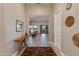 Bright entryway with wood accent table and view to living room at 31709 N 55Th Way, Cave Creek, AZ 85331