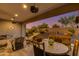 Covered patio with a large dining table and ceiling fans at 31709 N 55Th Way, Cave Creek, AZ 85331