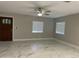 Bright living room with tile floors and ceiling fan at 122 N Sunaire --, Mesa, AZ 85205