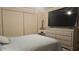 Relaxing bedroom with a large TV, dresser, and plenty of closet space at 305 S Val Vista Dr # 37, Mesa, AZ 85204